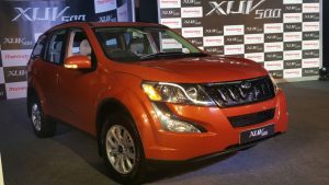 Mahindra xuv500 new model pics front angle sunset orange