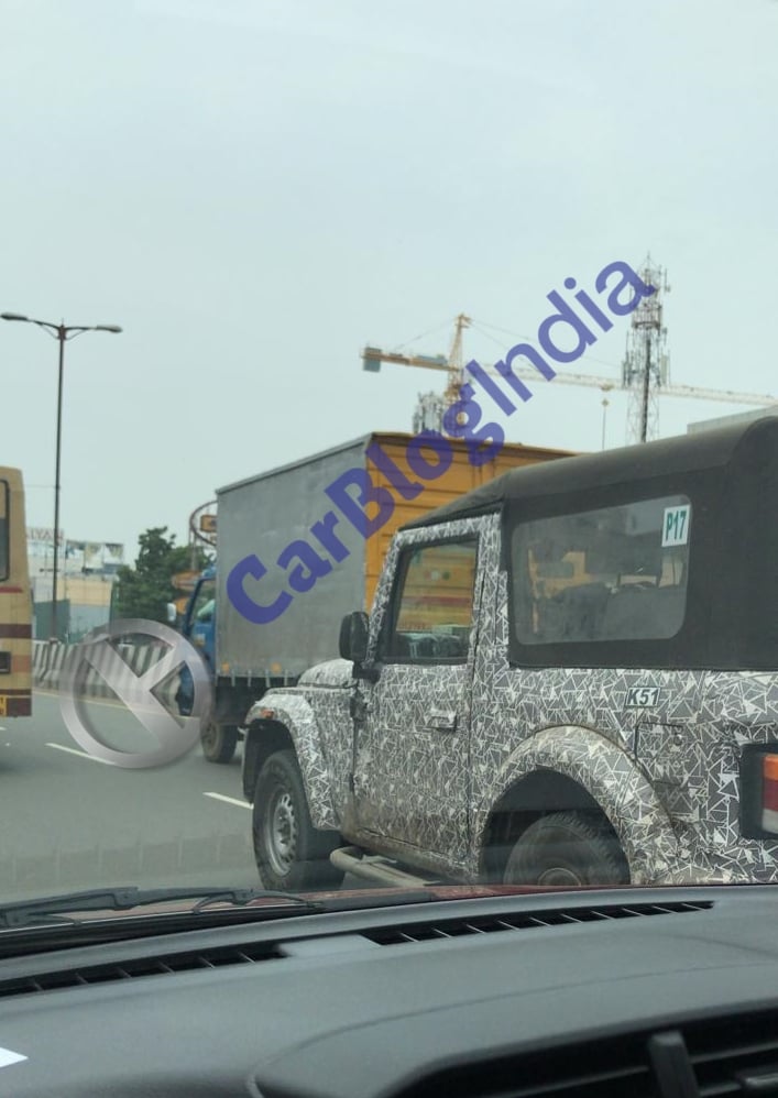 The spotted test mule of the next-gen Thar came with a soft top roof. 