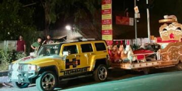 Hummer Pulling Marriage Stage on Road in India