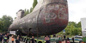 4 Trucks Pull Submarine in Germany