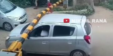 Maruti Alto Driver Breaks Railway Barrier at Crossing