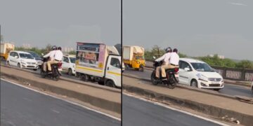 Traffic Police Riding Bike on Median