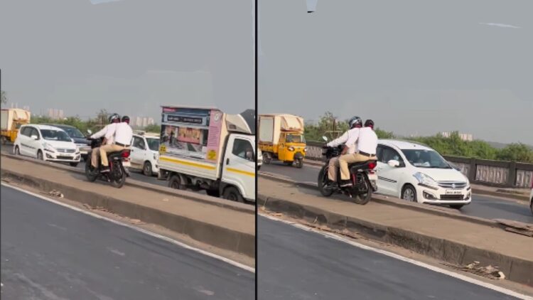 Traffic Police Riding Bike on Median