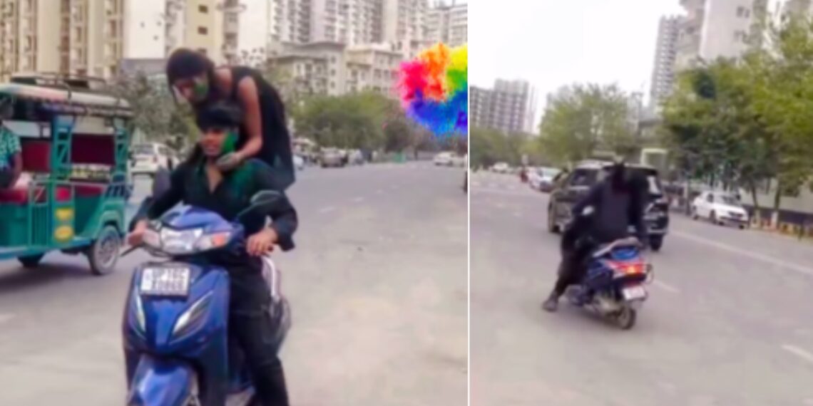 Girl Standing on Moving Scooter on Holi Falls on Road