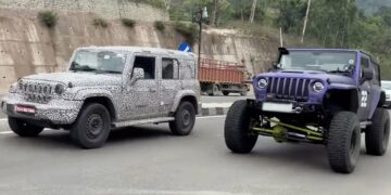 Mahindra Thar 5-door next to lifted 3-door Thar - Front Three Quarters