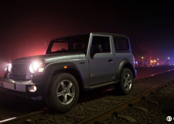 Mahindra Thar on railway track as train approaches