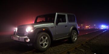 Mahindra Thar on railway track as train approaches