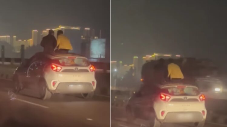 Two Men Sitting on Sunroof of Tata Nexon